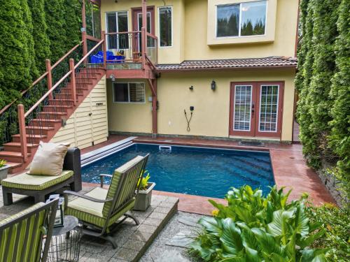 a swimming pool in front of a house at Luxury Retreat in Vancouver in Vancouver