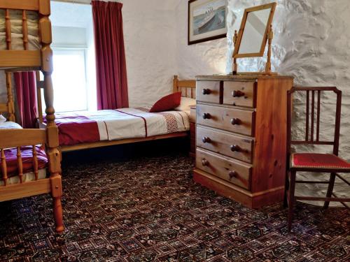 Postel nebo postele na pokoji v ubytování Porth Cormon Farmhouse