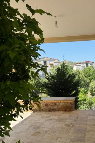 a view of a garden from a patio at Riverside Luxury Apartment in Štip