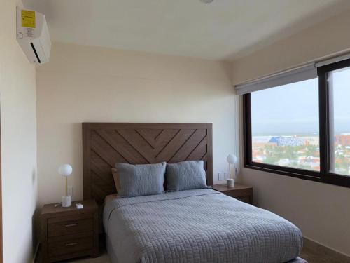 Giường trong phòng chung tại Apartment in Dos Arenas Marina Residencial