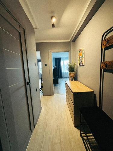 a room with a hallway with a dresser and a door at Mērsraga Miera Osta in Mērsrags