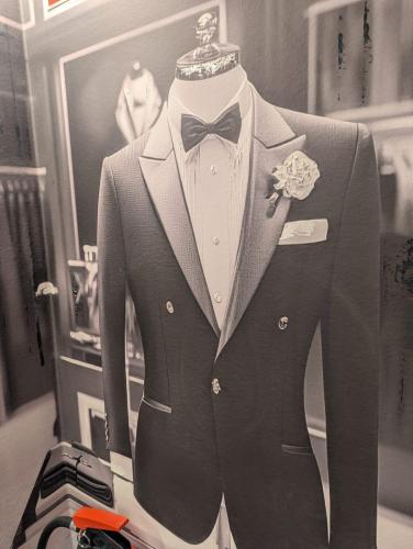 a suit and bow tie on a mannequin at Cinema City Hotel Europaplatz Karlsruhe - Brand New Boutique Hotel 2025 - in Karlsruhe