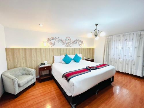 Postel nebo postele na pokoji v ubytování Hotel Rojas Inn