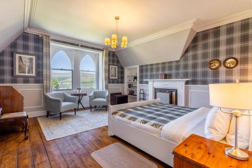 a bedroom with a bed and a living room at St Andrews House in Fort William