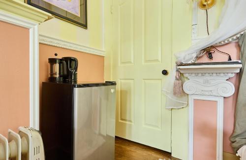 a kitchen with a refrigerator in a room at Hollywood Home in Los Angeles