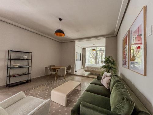 a living room with a couch and a table at CASA MIA by SERRA HOSPEDAJE in Guadalajara