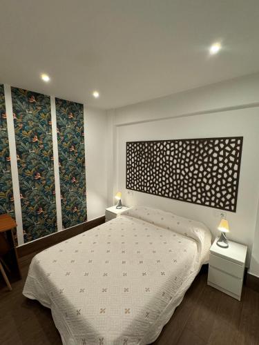 En eller flere senge i et værelse på Granada Center Chueca Deluxe Apartment