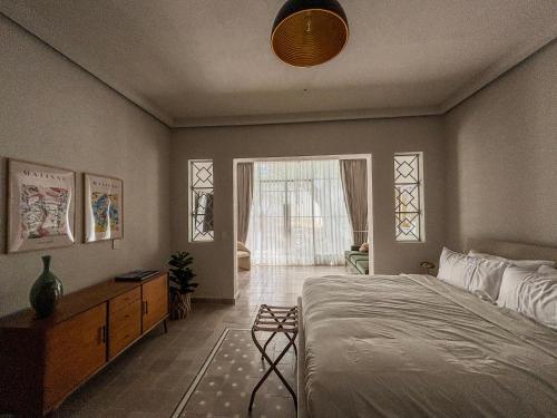 a bedroom with a large bed and a window at CASA MIA by SERRA HOSPEDAJE in Guadalajara