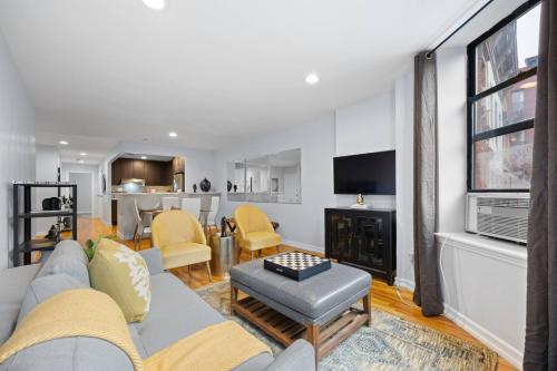 a living room with a couch and a fireplace at The Lenox in New York