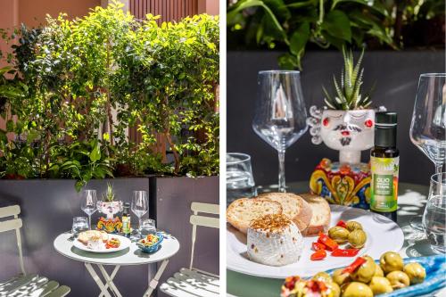 a table with plates of food and glasses of wine at Creuza De Ma in Riposto
