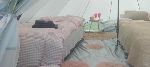 Postel nebo postele na pokoji v ubytování Camp THEA, jurta tent glamping