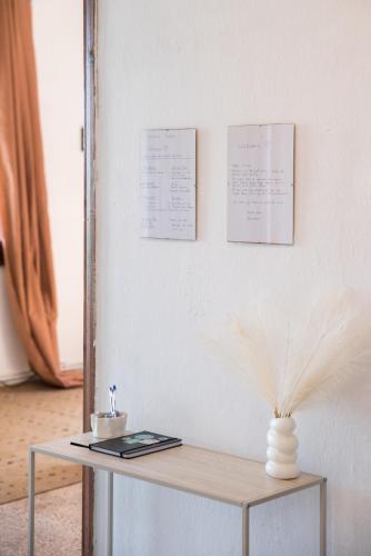 a table with a vase on top of it at Hestia in Mouresi