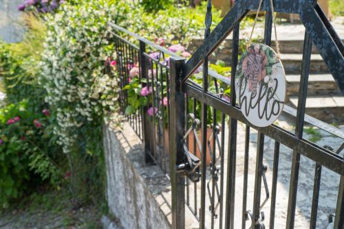 a black iron fence with flowers on it at Hestia in Mouresi