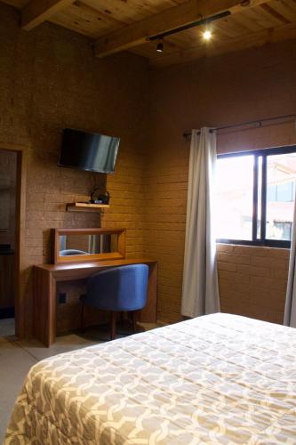 Ein Bett oder Betten in einem Zimmer der Unterkunft Colmar 48 Cabin