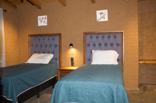 Ein Bett oder Betten in einem Zimmer der Unterkunft Colmar 48 Cabin