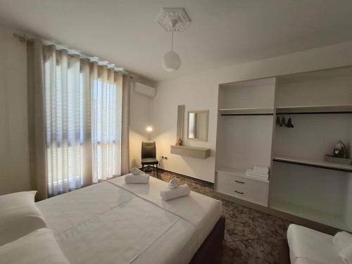 Postel nebo postele na pokoji v ubytování Melody Apartment Vlore