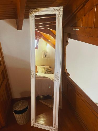 a mirror in the corner of a room with a bed at Margo Traditional House in Symi