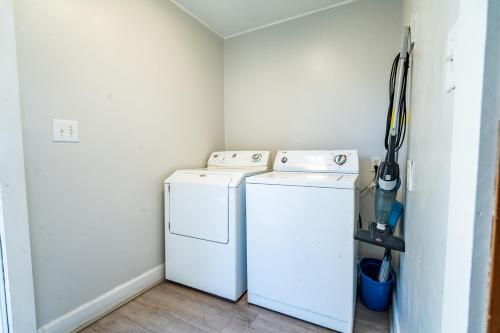 a laundry room with a washer and dryer at Atlantic Winds Condos in Myrtle Beach