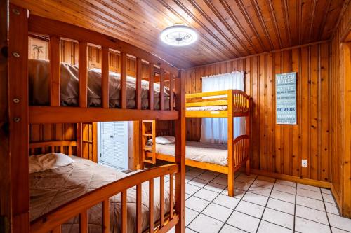 a room with two bunk beds in a cabin at Atlantic Winds Condos in Myrtle Beach