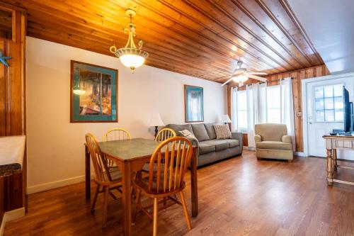 a living room with a table and a couch at Atlantic Winds Condos in Myrtle Beach