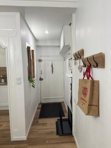 a room with a hallway with a door and a rug at Aroma Cite Vauban in Briançon