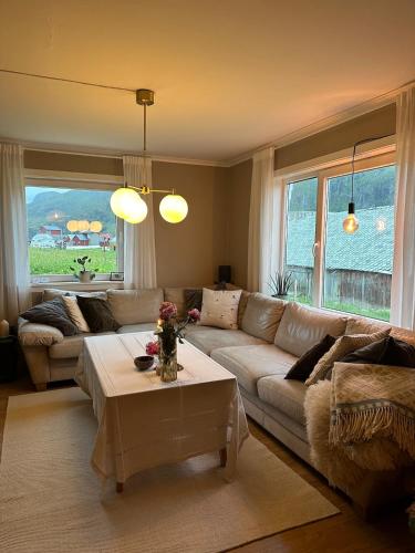 a living room with a couch and a table at Location, location, location in Ervik