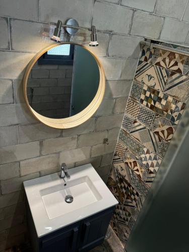 a bathroom with a sink and a mirror at Balsamaris in Manta Rota