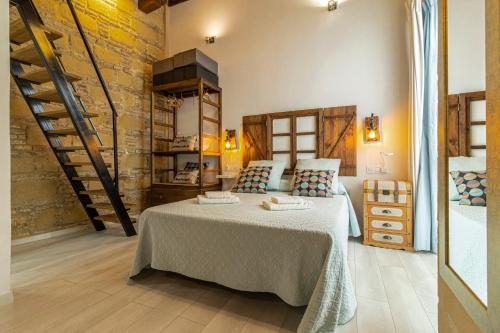 a bedroom with a large bed in a room at Exclusive Boutique in Jerez de la Frontera