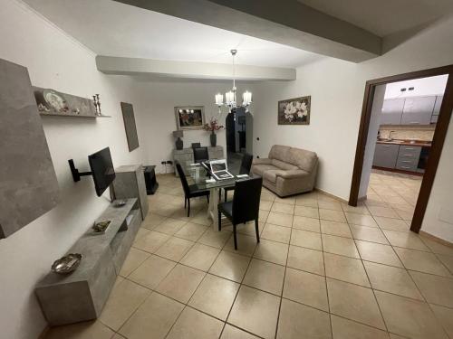 a living room with a table and a couch at La Rocchetta in Sutri
