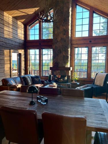 a large room with a large wooden table and chairs at "Rockyhill" Affordable beautiful luxury Lodge Idre sauna in Idre