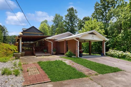 a home with a brick house with a porch at The Smoky Escape Unit 2 in Gatlinburg