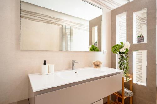 a bathroom with a white sink and a mirror at DaDa Luxury Home in Bari