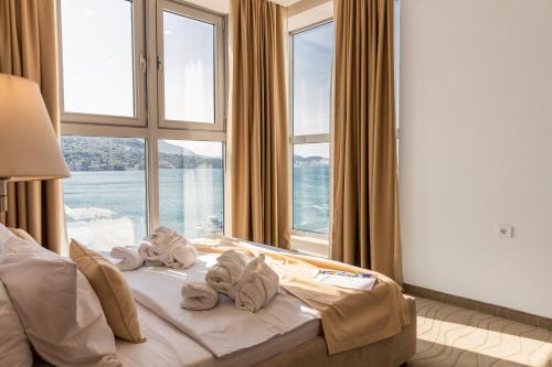 Postel nebo postele na pokoji v ubytování Hotel Porto Sole
