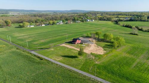 an aerial view of a farm in a field at Homestead Haven in Gettysburg