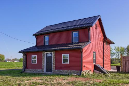 a red house with a black roof at Homestead Haven in Gettysburg