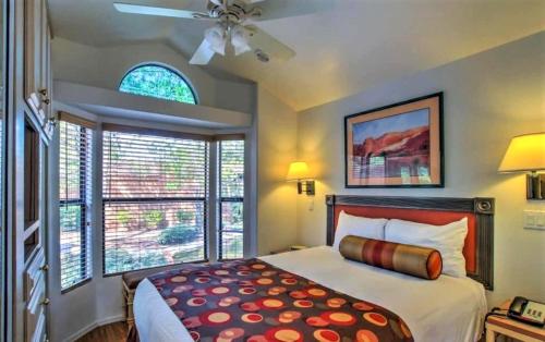 a bedroom with a bed and a ceiling fan at Getaways at Sedona Pines Resort in Sedona