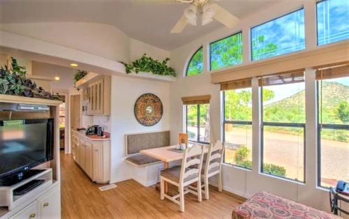 a tiny house with a kitchen and a dining room at Getaways at Sedona Pines Resort in Sedona