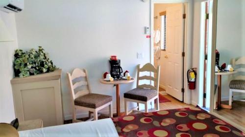 a room with two chairs and a table and a table at Getaways at Sedona Pines Resort in Sedona