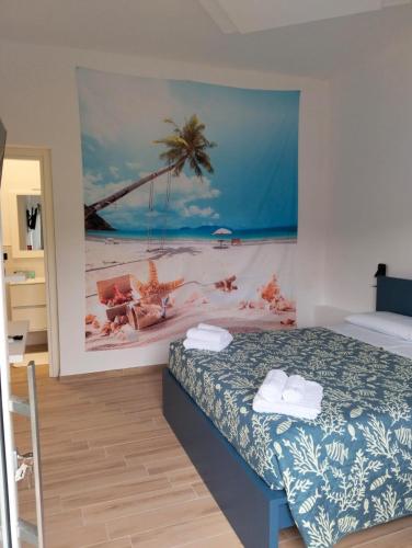 a bedroom with a bed with a painting on the wall at Fishermen Bros in Francavilla al Mare