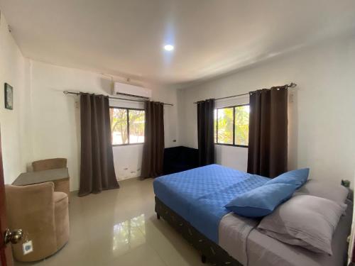 Postel nebo postele na pokoji v ubytování La Puerta de Malacatiupan