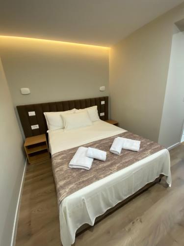 Postel nebo postele na pokoji v ubytování Petite Maison Hermes Center