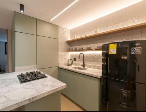 Kuchyň nebo kuchyňský kout v ubytování Obo Hotel