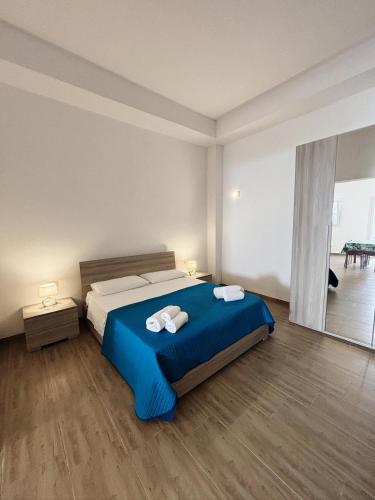 Ένα ή περισσότερα κρεβάτια σε δωμάτιο στο " la TONNARA CASA VACANZE "