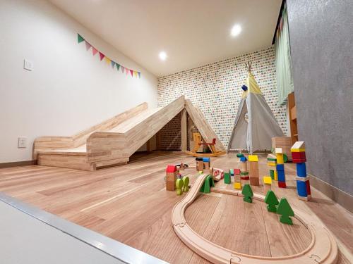 a room with a play area with a tent and toys at Lake Toya Base -Lake Toya BLDG 1F in Lake Toya