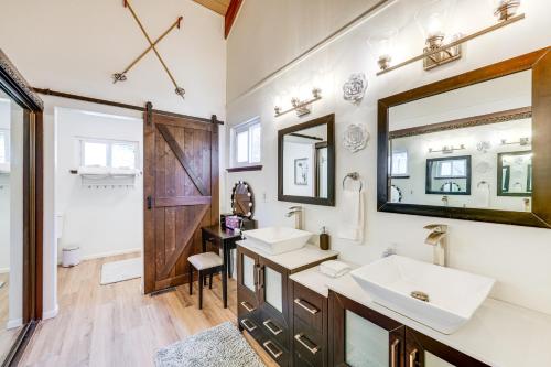 a bathroom with two sinks and a mirror at Private Hot Tub at Dog-Friendly Lake Arrowhead Gem in Lake Arrowhead