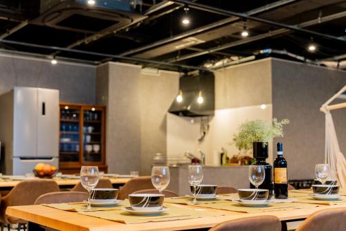 a table with wine glasses on it in a restaurant at Lake Toya Base -Lake Toya BLDG 1F in Lake Toya