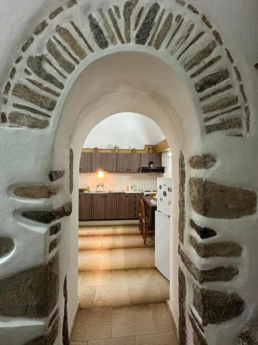 an archway leading into a kitchen with a kitchen at Katsi Traditional & Medieval House in Mesta