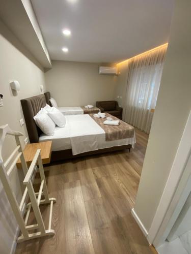 Postel nebo postele na pokoji v ubytování Petite Maison Hermes Center