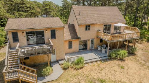 an aerial view of a house with a deck at Walk to Pond 2 Min Drive to Beach in Eastham