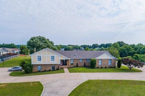 a large house with a car parked in a driveway at The Loft 1335 Whitt Ln in Clarksville